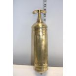 A vintage military issue brass fire extinguisher