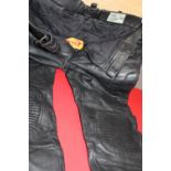 A pair of leather motor bike trousers size 34