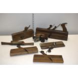 A selection of vintage wood working moulding planes etc