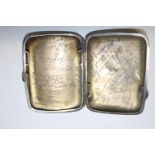 A interesting 1930 hallmarked silver cigarette case with hand engraved signatures of famous