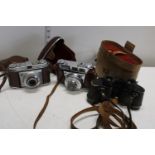 A pair of Ross stereo prism binoculars & two vintage cameras