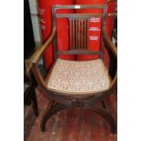 An Edwardian mahogany curule chair in the manner of Gillows C 1890. collection only