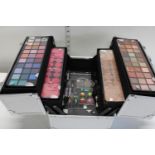 A new boxed cosmetic set, new but inner trays slighty damaged