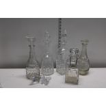 Five assorted cut glass decanters