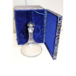 A Lovely Glass Ships decanter with etched pattern. Presented in a Black, Blue and White patterned