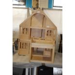 A good quality large wooden dolls house