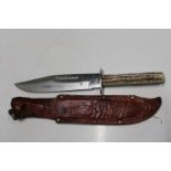 A Bowie style knife with scabbard
