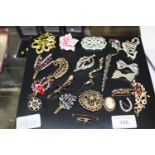 A good selection of vintage costume brooches
