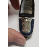 A boxed hallmarked silver thimble