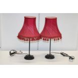 Two vintage table lamps with red shades