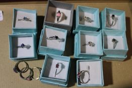 A selection of boxed costume rings