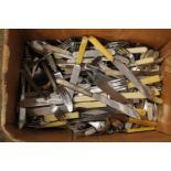 A large box of assorted vintage cutlery