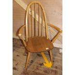 A vintage Ercol spindle back chair in light wood