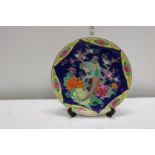 A Japanese Bird and Flower decorated Large Plate.. Stamped on the back
