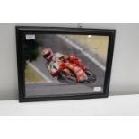 A framed & signed Carl Fogarty photo with COA