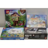 Four boxed Lego models