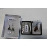 Two pairs of 925 silver earrings and 925 drop earring with amber decoration