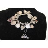 Sterling silver bracelet and assorted white metal charms