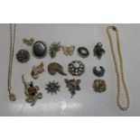 A job lot of vintage costume brooches etc