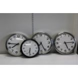 Four battery powered modern wall clocks
