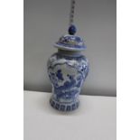 A large hand decorated blue ground ginger jar