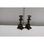 Two unusual bronze candle sticks