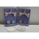 Two Claire's fashion headphone sets