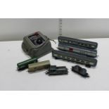 A selection of assorted model train carriages and power control unit