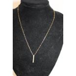 A 9ct gold necklace and pendant 3.1g