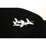 A Eric Magnussen sterling silver and enamel geese in flight brooch