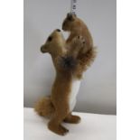 A mother and baby faux squirrel figure