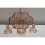 A pretty dusty pink glass dressing table set