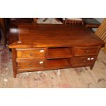 A wooden coffee table with four storage drawers 125x54x69cm collection only