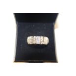 A heavy 14ct gold ring set with round & baguette cut stones