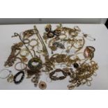 A job lot of assorted gold coloured costume jewellery