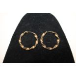 A pair of large 9ct gold twisted style earrings
