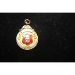 A 9ct gold fob pendant with the three lion to the front