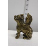 An antique Oritental brass mystical beast figure