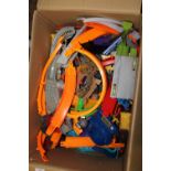 A large box of Hot Wheels and other accessories/track etc