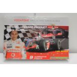 A boxed Lewis Hamilton Mclaren Mercedes Micro Scalextric set
