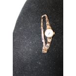 A vintage Ladies 9ct gold body & strap cocktail watch