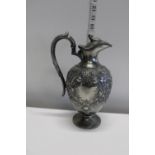 A antique silver plated claret jug