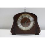 A antique wood cased mantle clock