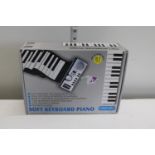 A boxed soft keyboard piano