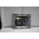 A silver gilt framed Chanel mirror. 51cm x 41cm