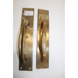 Two vintage brass push handles