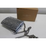 A boxed Harlem Carter clear crystal clutch bag