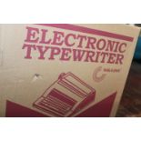 A boxed vintage electronic typewriter. Collection only