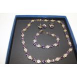 A costume jewellery necklace, bracelet, ring & earring set