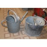 A galvanised watering can & mop bucket